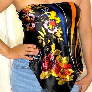 Black floral top. Available in sizes Small, Medium, and Large